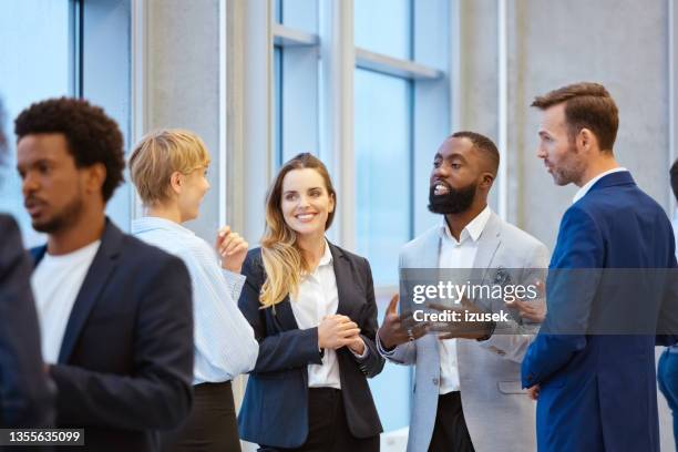 business people in convention center - panel discussion stock pictures, royalty-free photos & images