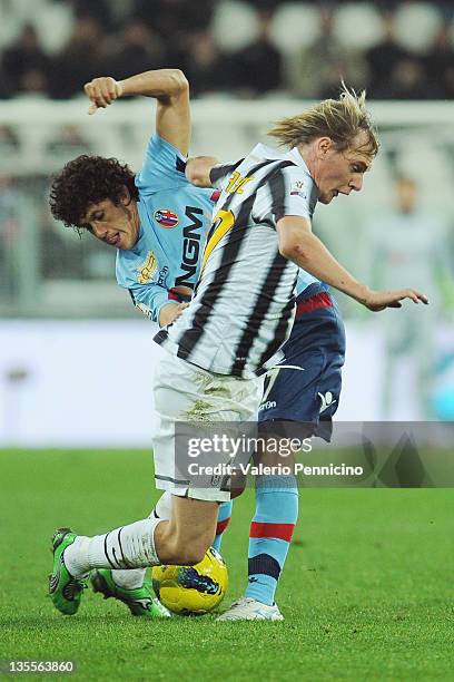 Milos Krasic of Juventus FC is challenged by Henry Damian Gimenez of Bologna FC during the Tim Cup match between Juventus FC and Bologna FC at...