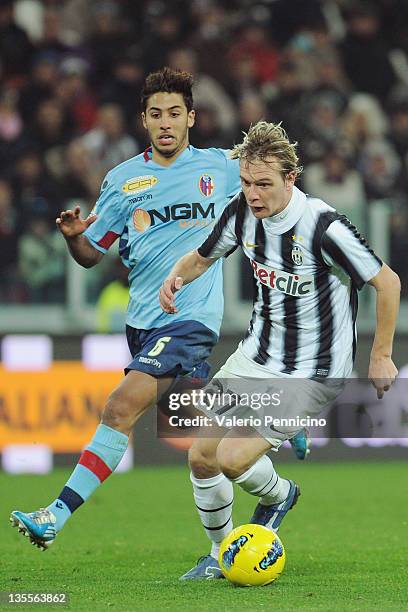 Milos Krasic of Juventus FC in action against Saphir Sliti Taider of Bologna FC during the Tim Cup match between Juventus FC and Bologna FC at...