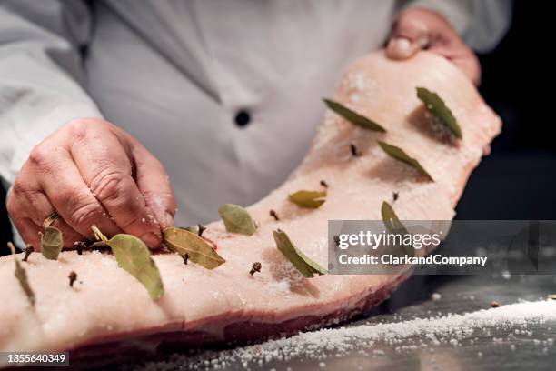 preparing roast pork - bay leaf stock pictures, royalty-free photos & images