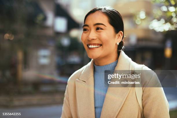 happy business woman in the city - mongolian women stock pictures, royalty-free photos & images