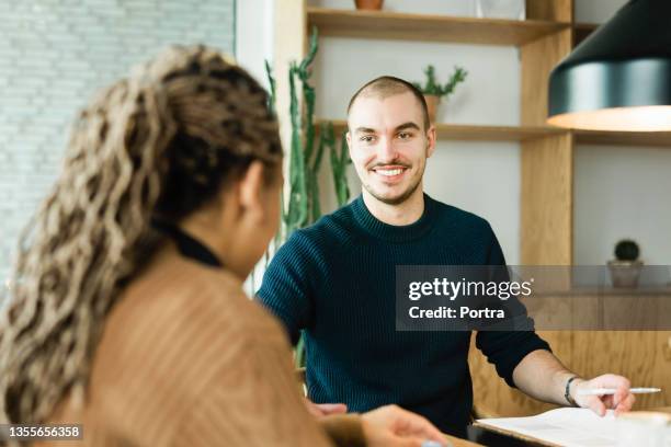 hr manager interviewing woman in modern office - recruiter stock pictures, royalty-free photos & images