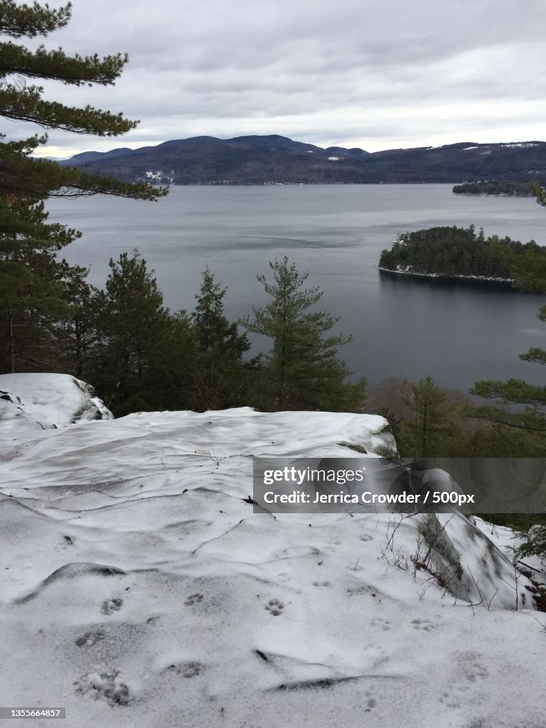 Newfound Lake,Scenic view of lake against sky during winter