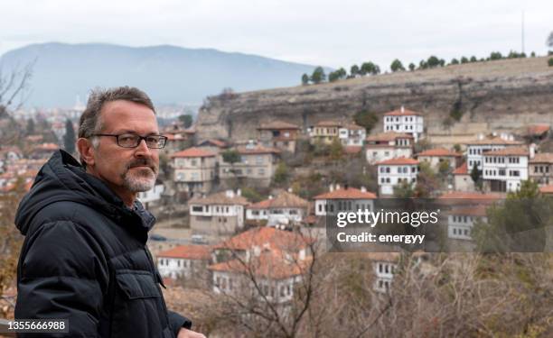 mature male tourist visiting turkey - safranbolu turkey stock pictures, royalty-free photos & images