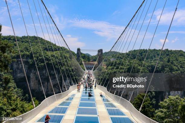 exploring the zhangjiajie glass bridge - zhangjiajie stock pictures, royalty-free photos & images