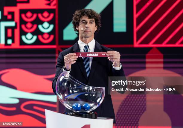 Legend Tiago Mendes draws out the card of Russia during the FIFA World Cup Qatar 2022 European Play-Off Draw on November 26, 2021 in Zurich,...