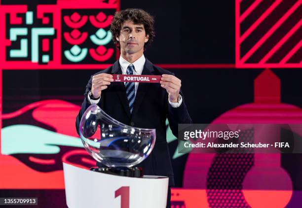 Legend Tiago Mendes draws out the card of Portugal during the FIFA World Cup Qatar 2022 European Play-Off Draw on November 26, 2021 in Zurich,...