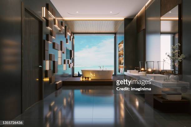 modernes luxuriöses badezimmerinterieur mit whirlpool und herrlichem meerblick - bathroom tiles stock-fotos und bilder