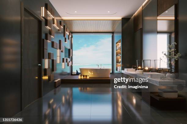 modern luxury bathroom interior with hot tub and beautiful sea view - hotel bathroom stock pictures, royalty-free photos & images