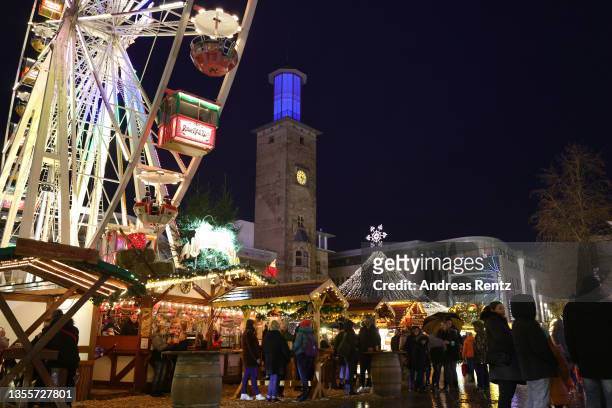 Guests stroll through the alleys at the annual Christmas market during the fourth wave of the novel coronavirus pandemic on November 26, 2021 in...