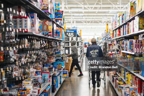 People shop in a Walmart store during Black Friday on November 26, 2021 in Houston, Texas. Retailers are anticipating a busier holiday season than...