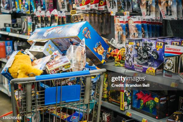 Basket full of toys is seen in a Walmart store during Black Friday on November 26, 2021 in Houston, Texas. Retailers are anticipating a busier...