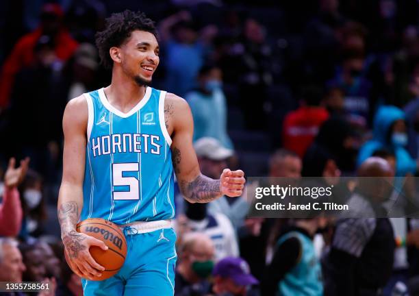 James Bouknight of the Charlotte Hornets looks on following the game against the Minnesota Timberwolves at Spectrum Center on November 26, 2021 in...