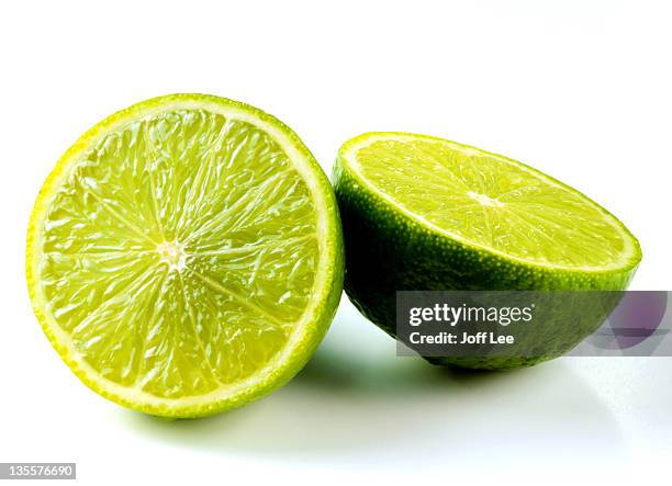 lime sliced in half - lime stock pictures, royalty-free photos & images