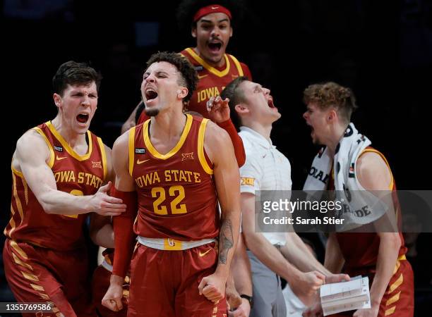 Gabe Kalscheur of the Iowa State Cyclones reacts with Caleb Grill after making a three-point shot during the second half against the Memphis Tigers...