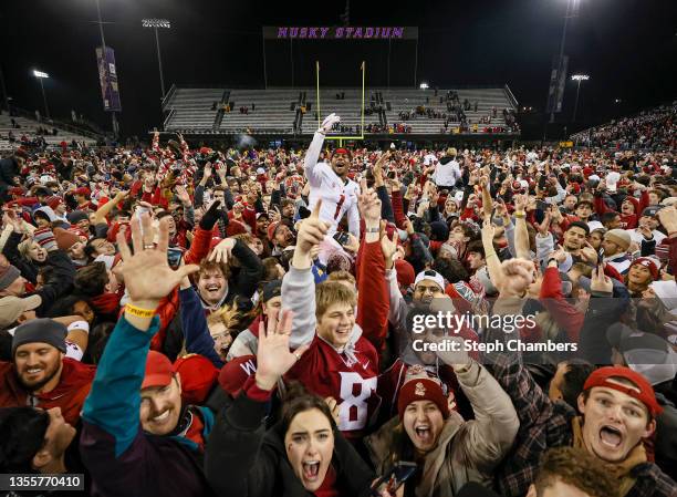 Tyrone Hill Jr. #1 of the Washington State Cougars celebrates with fans after defeating the Washington Huskies 40-13 to win the Apple Cup at Husky...