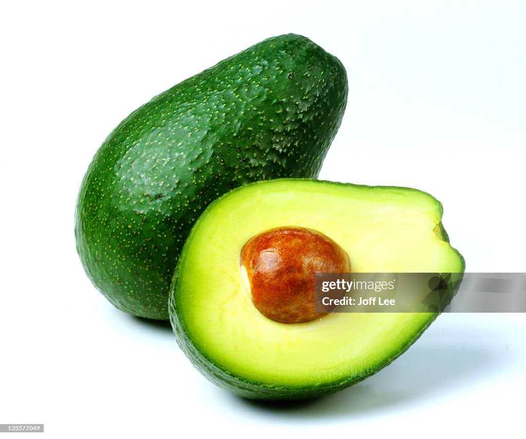 Fuerte avocado cut in half with stone exposed