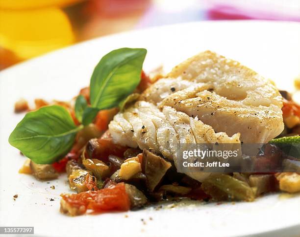cod fillet with aubergine & tomato salsa - baccalà foto e immagini stock