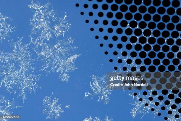 ice crystals on outer surface of windshield and embedded dots on windshield glass - voorruit stockfoto's en -beelden