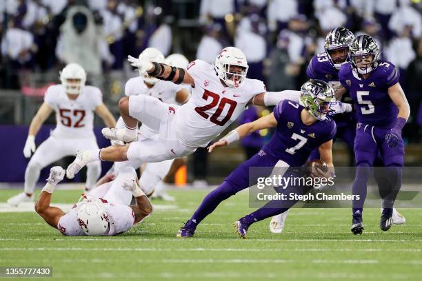 Quinn Roff of the Washington State Cougars sacks Sam Huard of the Washington Huskies during the fourth quarter at Husky Stadium on November 26, 2021...