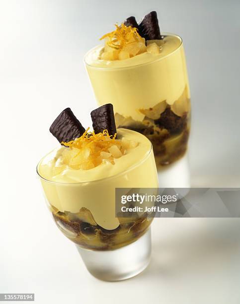 two cointreau custard trifles in glasses - trifle stock pictures, royalty-free photos & images