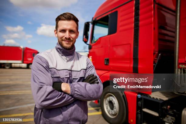 truck driver in front of truck with arms crossed - truck driver stock pictures, royalty-free photos & images