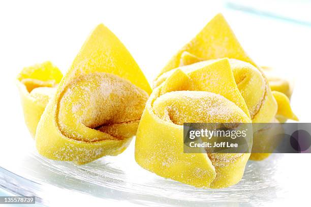 uncooked fresh tortellini - tortellini stock pictures, royalty-free photos & images