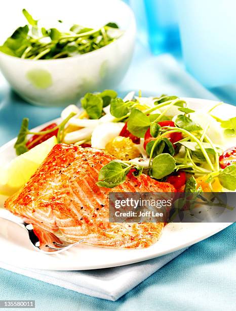baked fillet of trout with watercress salad - trout stock pictures, royalty-free photos & images