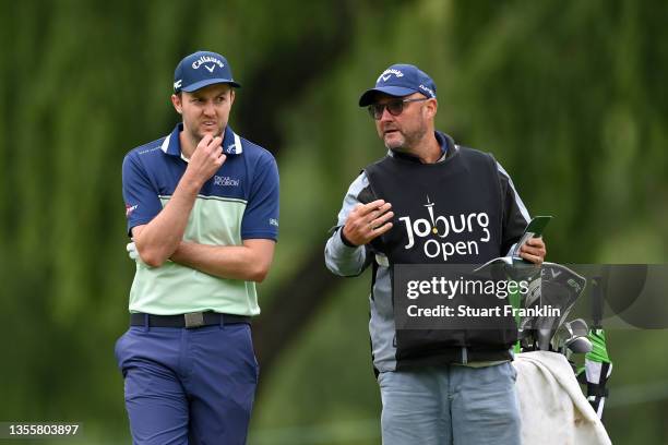 Ashley Chesters of England and caddie look on during Day Three of the JOBURG Open at Randpark Golf Club on November 27, 2021 in Johannesburg, South...