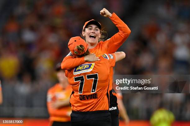 Heather Graham and Sophie Devine of the Scorchers celebrate after winning the final og the Women's Big Bash League match between the Perth Scorchers...