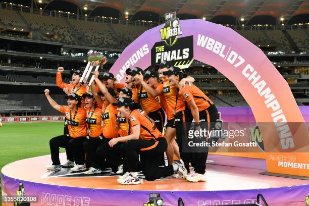 The Scorchers celebrate with the WBBL 07 Champions trophy after winning the Women's Big Bash League match between the Perth Scorchers and the...