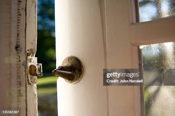 screen door latch at an old summer home - latch fotografías e imágenes de stock