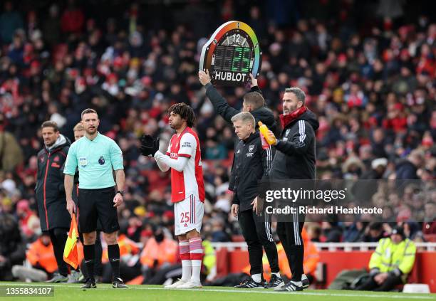 Fourth official Robert Jones shows the LED substitution board, which features a rainbow as part of the Stonewall Rainbow Laces campaign, as Mohamed...