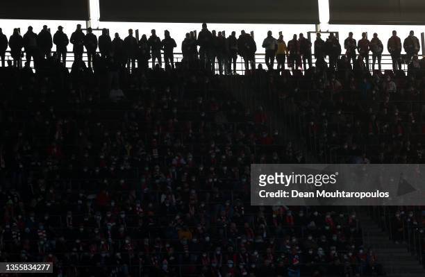 Silhouette of fans watching on during the Bundesliga match between 1. FC Köln and Borussia Mönchengladbach at RheinEnergieStadion on November 27,...