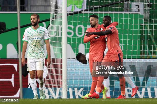 Ihlas Bebou of TSG 1899 Hoffenheim celebrates with teammate Munas Dabbur after scoring their side's first goal during the Bundesliga match between...