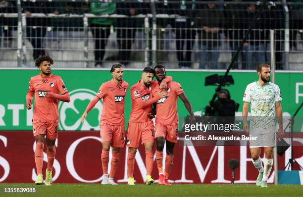 Ihlas Bebou of TSG 1899 Hoffenheim celebrates with teammate Munas Dabbur after scoring their side's first goal during the Bundesliga match between...