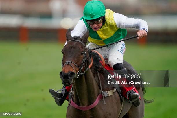 Charlie Deutsch riding Cloudy Glen clear the last to win The Ladbrokes Trophy Chase at Newbury Racecourse on November 27, 2021 in Newbury, England.