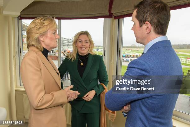 Madeleine Lloyd Webber, Isabella Lloyd Webber and Jimmy Carr attend the Ladbrokes Winter Carnival on Ladbrokes trophy day at Newbury Racecourse on...