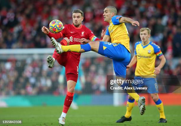 Jordan Henderson of Liverpool battles for possession with Oriol Romeu of Southampton during the Premier League match between Liverpool and...