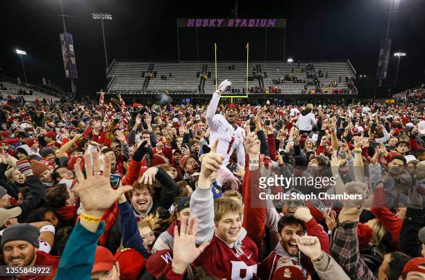 Tyrone Hill Jr. #1 of the Washington State Cougars celebrates with fans after defeating Washington Huskies 40-13 to win the Apple Cup at Husky...