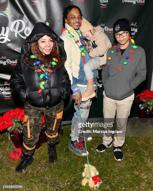 Tameka 'Tiny' Harris, T.I., Heiress Diana Harris, and Major Philant Harris attend Holiday Road Atlanta Friends & Family Preview Night 2021 at The...