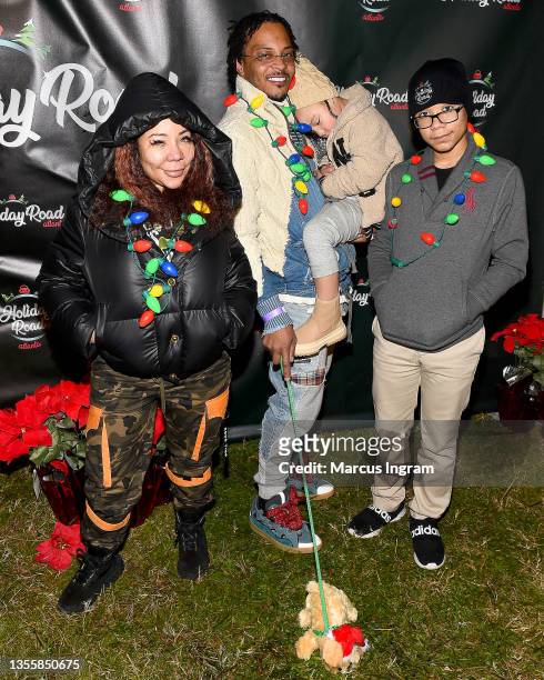 Tameka 'Tiny' Harris, T.I., Heiress Diana Harris, and Major Philant Harris attend Holiday Road Atlanta Friends & Family Preview Night 2021 at The...
