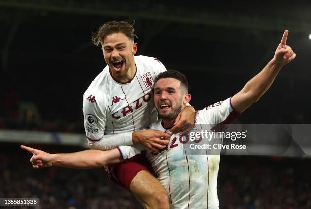 John McGinn of Aston Villa celebrates with teammate Matty Cash after scoring their side's second goal during the Premier League match between Crystal...