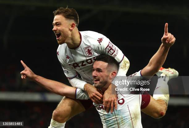 John McGinn of Aston Villa celebrates with teammate Matty Cash after scoring their side's second goal during the Premier League match between Crystal...