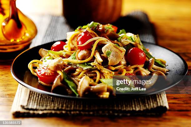 thai chicken stirfry with noodles - thai food stock pictures, royalty-free photos & images