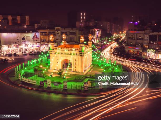 charminar chorangi karachi illuminated with green lights - pakistan monument stock pictures, royalty-free photos & images