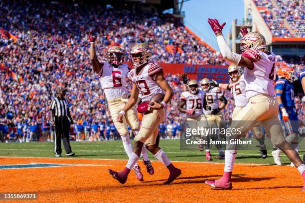 Jordan Travis of the Florida State Seminoles celebrates after scoring a touchdown during the second quarter of a game against the Florida Gators at...