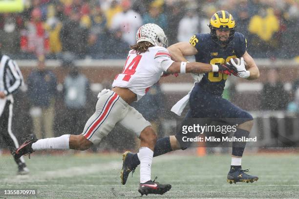 Luke Schoonmaker of the Michigan Wolverines carries the ball against the Ohio State Buckeyes during the second quarter at Michigan Stadium on...