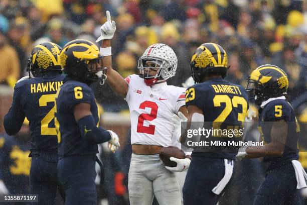 Chris Olave of the Ohio State Buckeyes reacts after a first down reception against the Michigan Wolverines during the second quarter at Michigan...