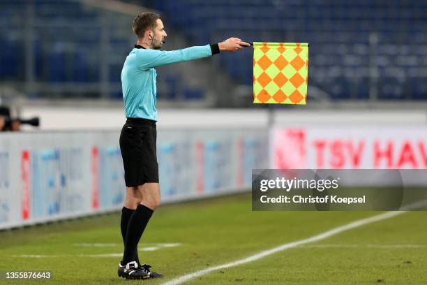 Linesman Tobias Wittmann raises the flag during the 3. Liga match between TSV Havelse and TSV 1860 München at HDI-Arena on November 27, 2021 in...